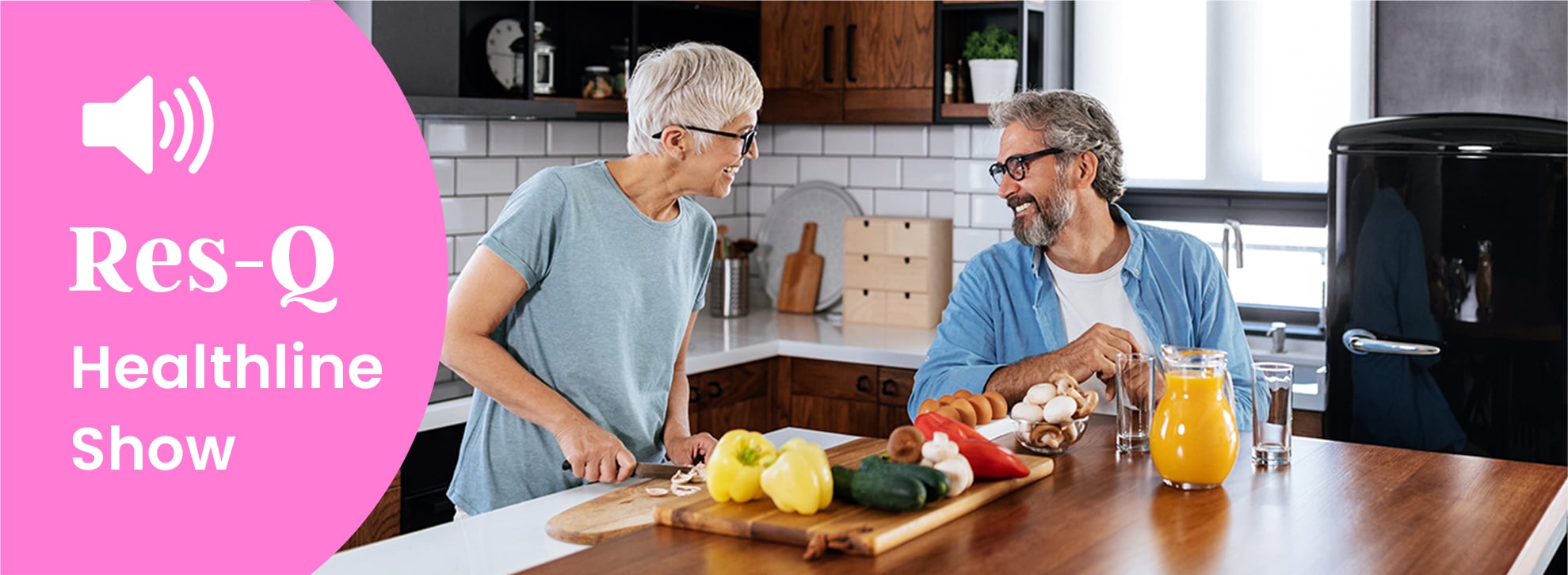 Middle-aged couple making a healthy breakfast in the kitchen