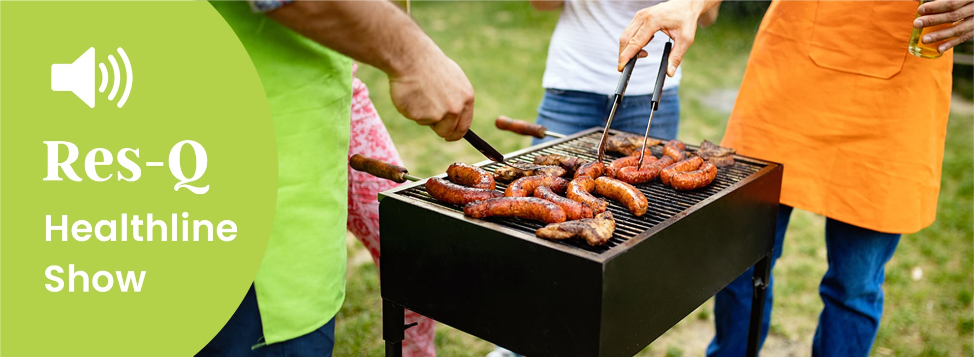 people cooking around a grill