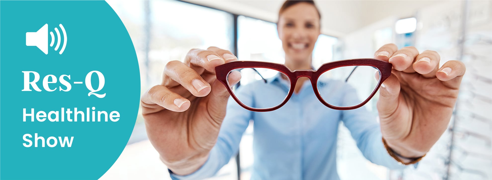 Female optometrist with a pair of glasses