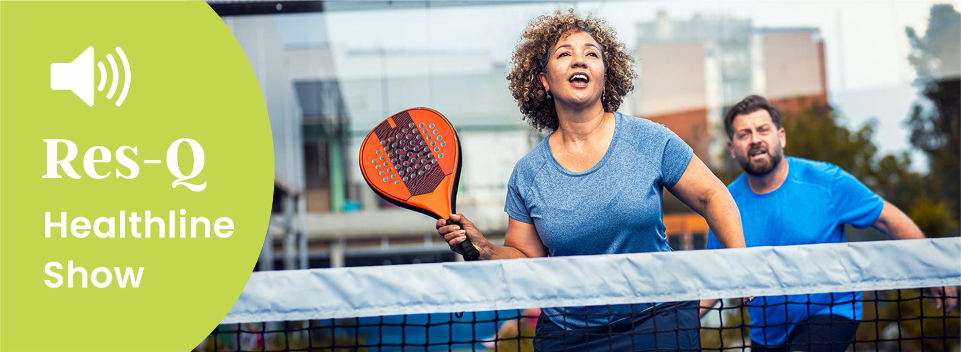 Middle-aged couple playing pickleball