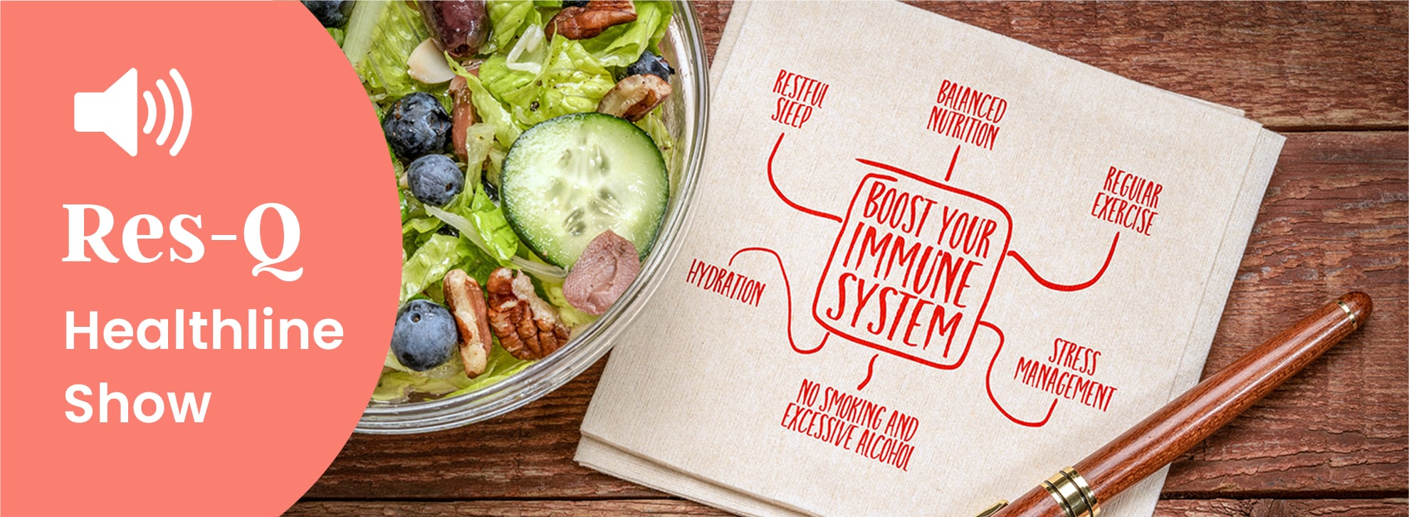 A salad next to a napkin with Boost Your Immune System written on it