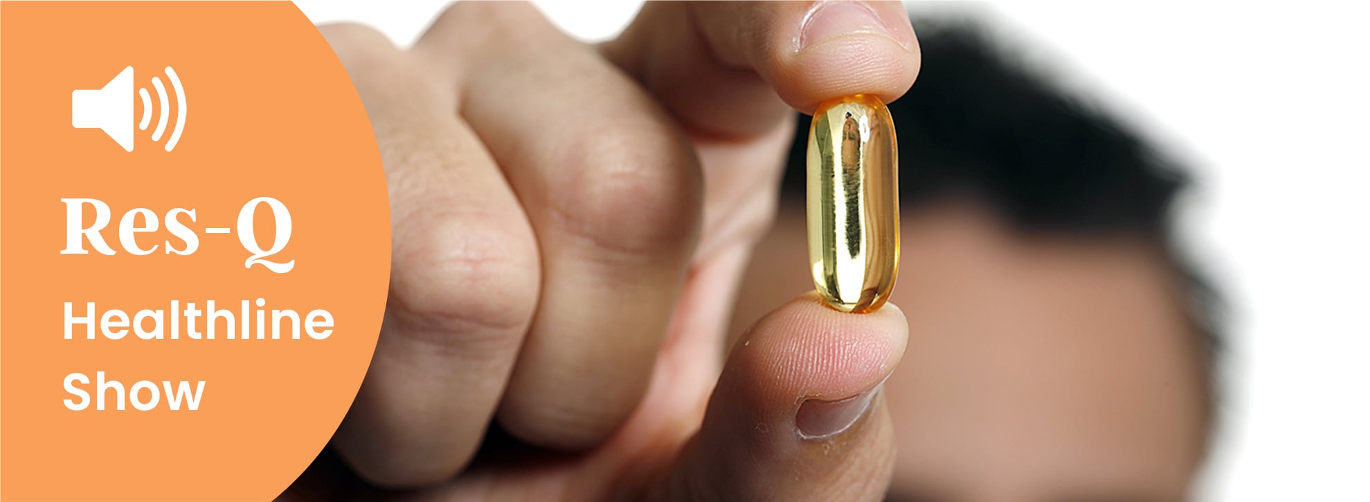 A man holding a capsule up to the camera