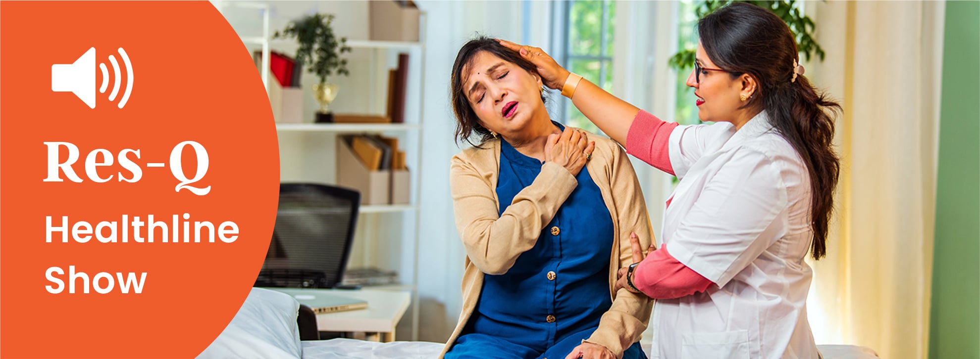 A middle-aged Indian women gets her neck examined by a female doctor