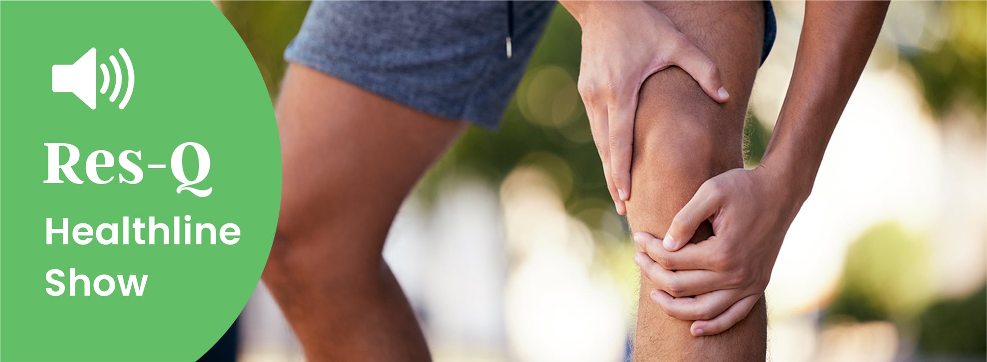 Man grabbing his knee while running outside