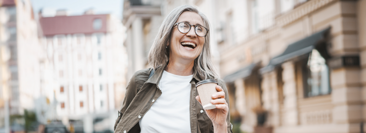 Woman happy with coffee.
