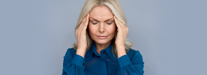 Woman suffering with menopause headache